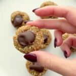 A hand holding simple date bites