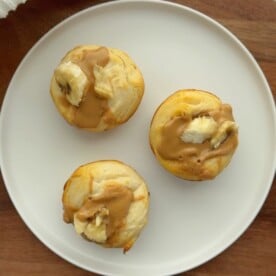 Three toddler-friendly Peanut Butter Banana Biscuits on a white plate