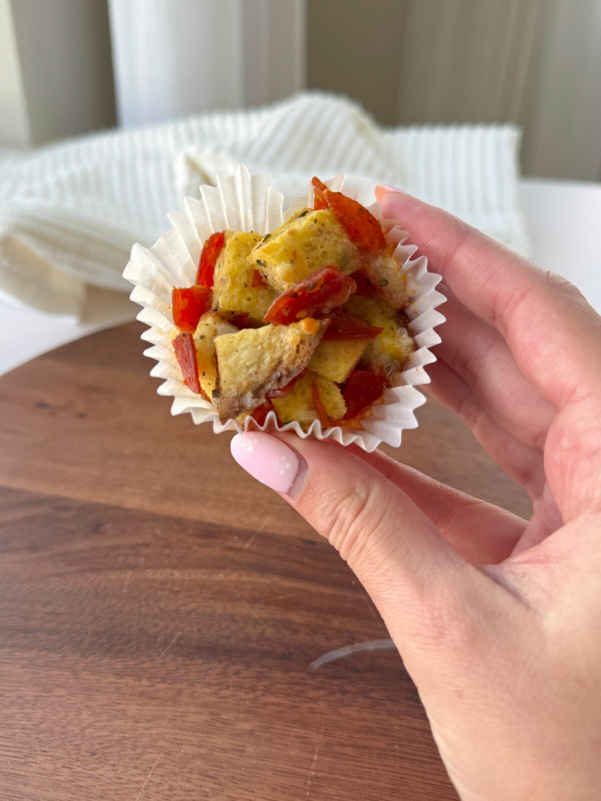 Bread, pepperoni, and cheese together in a delicious easy pizza cup