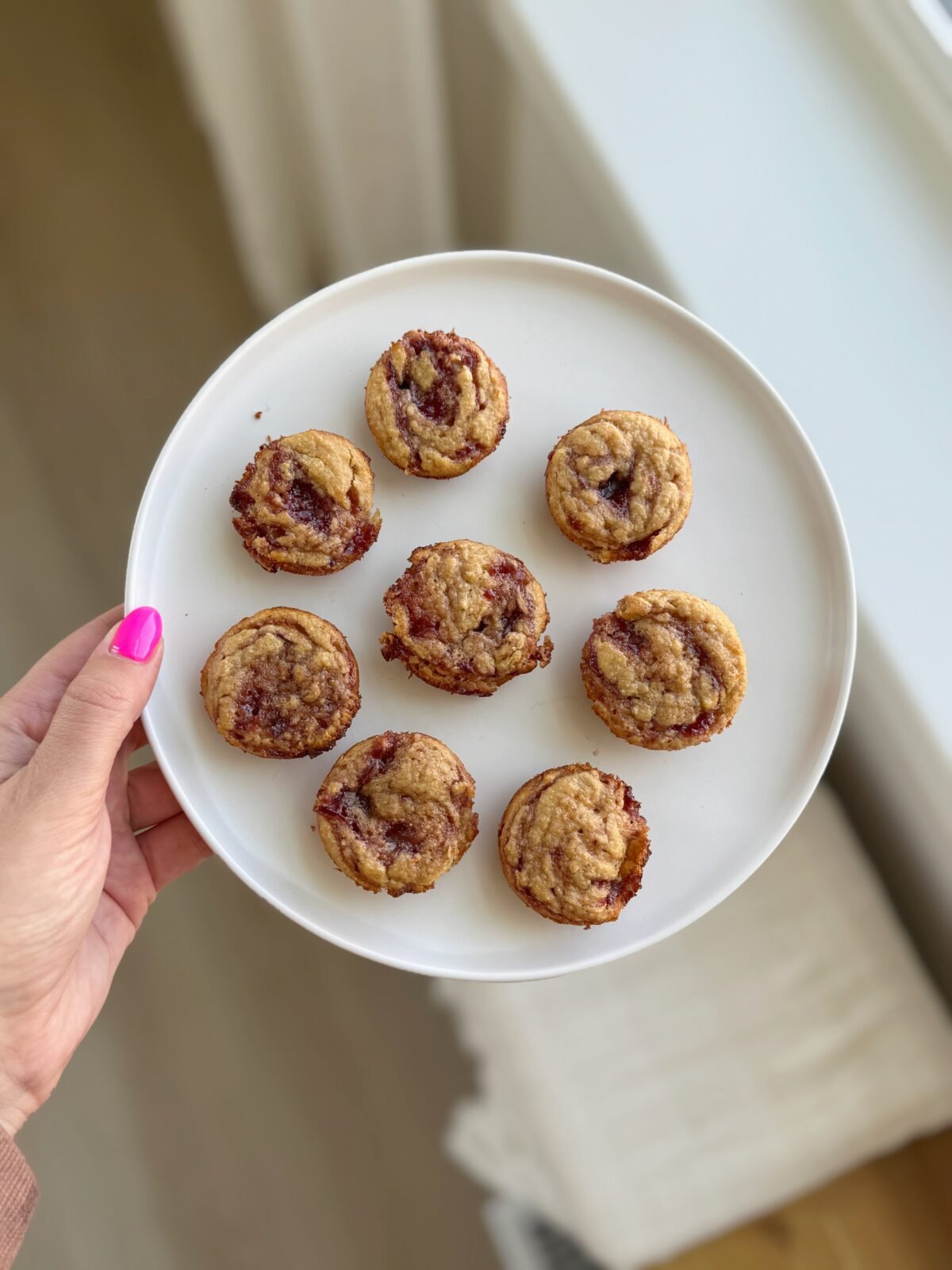 PB&J protein muffins on a white plate
